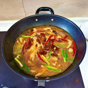 Spicy Braised Chicken Feet with Rice Cakes