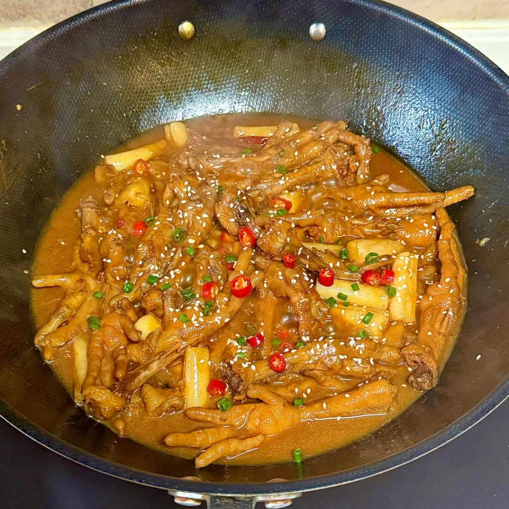 Spicy Braised Chicken Feet with Rice Cakes