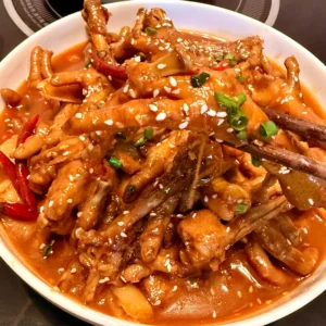 Spicy Braised Chicken Feet with Rice Cakes