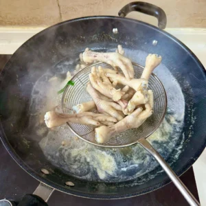 Spicy Braised Chicken Feet with Rice Cakes