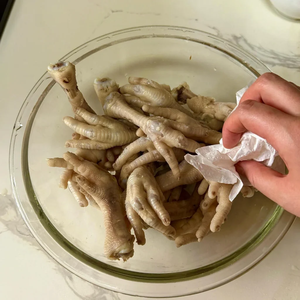 Spicy Braised Chicken Feet with Rice Cakes