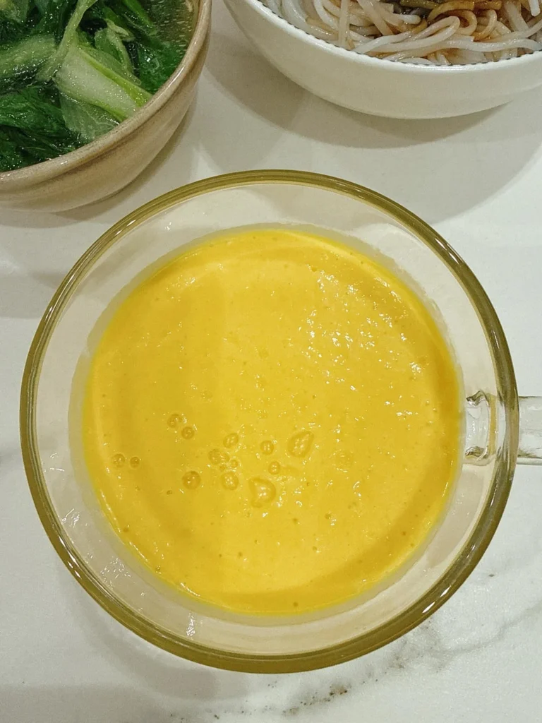 Breakfast: Scallion Oil Rice Noodles, Mango Smoothie, Soft-Centered Egg & Ginger Baby Bok Choy