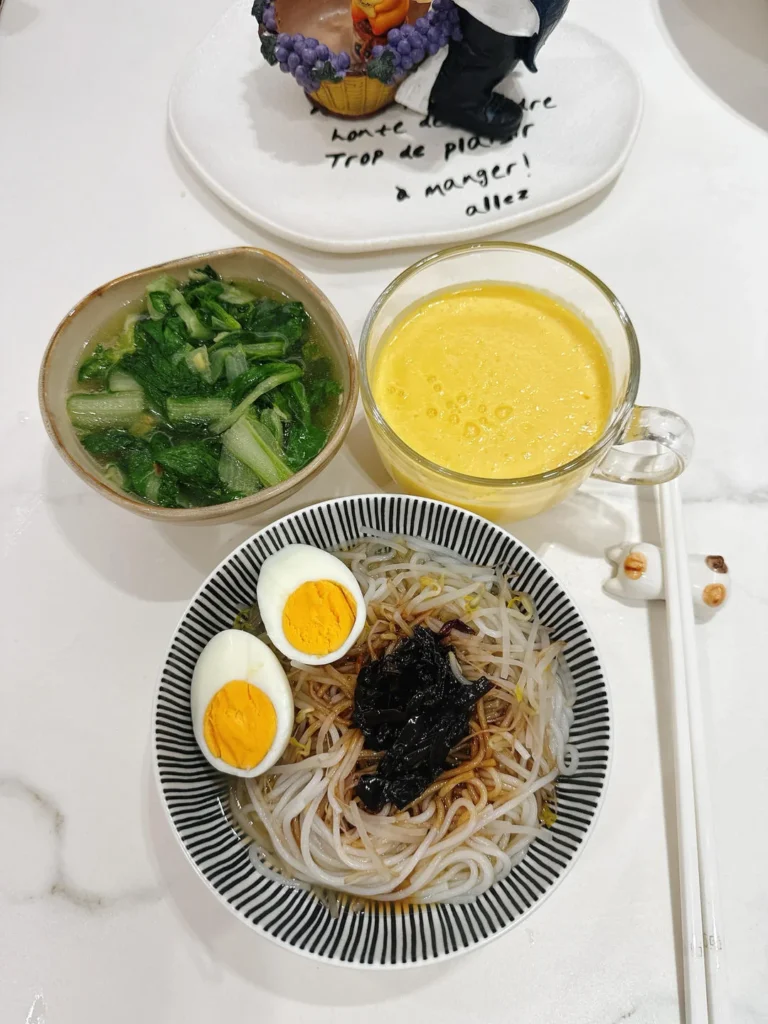 Breakfast: Scallion Oil Rice Noodles, Mango Smoothie, Soft-Centered Egg & Ginger Baby Bok Choy