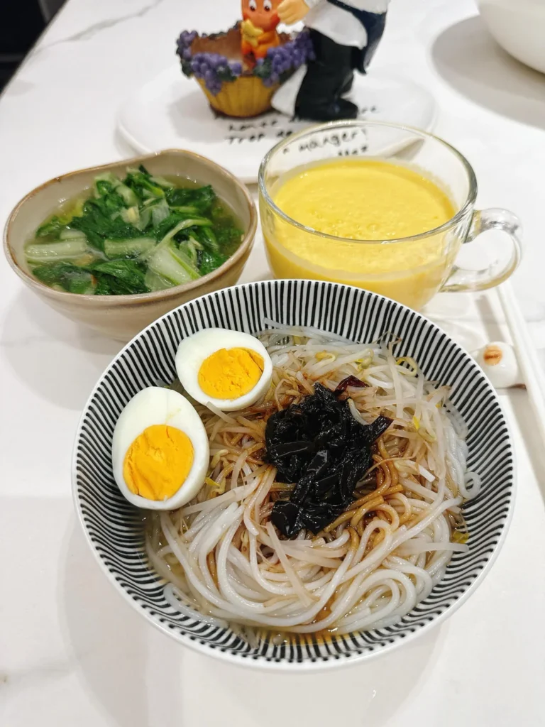 Breakfast: Scallion Oil Rice Noodles, Mango Smoothie, Soft-Centered Egg & Ginger Baby Bok Choy