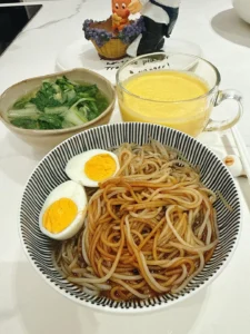 Breakfast: Scallion Oil Rice Noodles, Mango Smoothie, Soft-Centered Egg & Ginger Baby Bok Choy