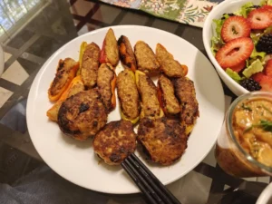 Chicken-Stuffed Mini Bell Peppers & Button Mushrooms with Creamy Tomato Onion Sauce