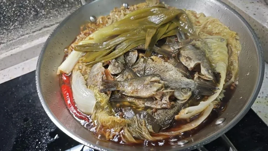 Slow-Braised Crucian Carp with Napa Cabbage (Zaoyu)